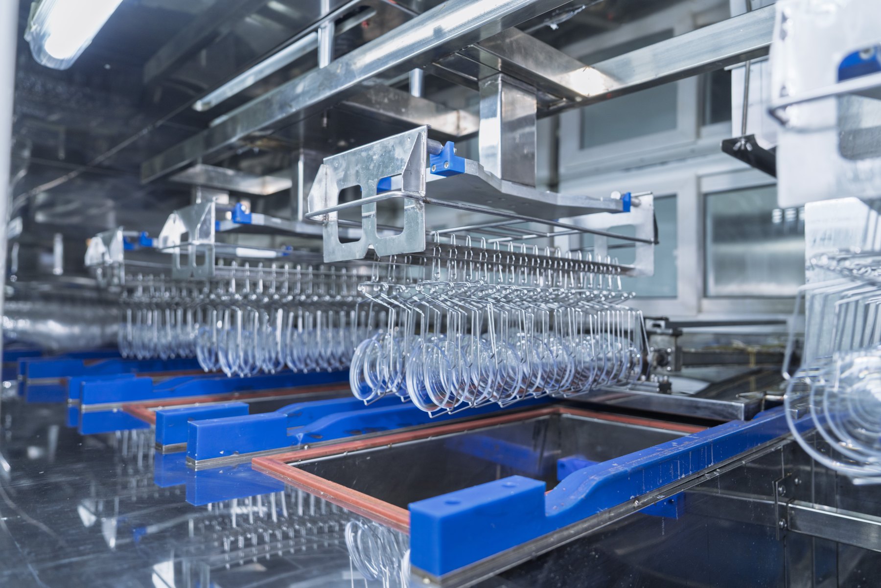 Lenses moving through the coating line